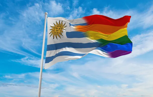 ウルグアイ国旗が曇り空で風になびいています 自由と愛の概念 プライド月間だ 行動主義共同体自由概念です コピースペース 3Dイラスト — ストック写真