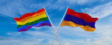 LGBT ve Ermenistan bayraklarını aşıp bulutlu gökyüzünde rüzgarda dalgalanan bayrak. Özgürlük ve aşk kavramı. Gurur ayı. Eylemcilik, toplum ve özgürlük kavramı. Boşluğu kopyala