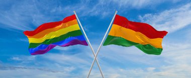 Lgbt ve Black History 'nin bayraklarını aşıp bulutlu gökyüzünde rüzgarda dalgalanan ay bayrağı. Özgürlük ve aşk kavramı. Gurur ayı. Eylemcilik, toplum ve özgürlük kavramı. Uzayı kopyala 3d illüstrasyon