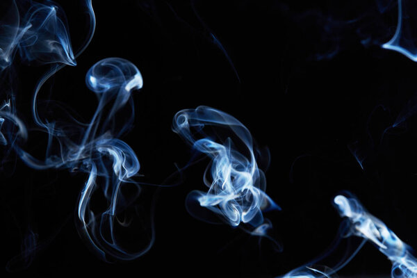 Smoke on black background with abstract blur motion wave swirl . Wisp of Smoke. Cigarette smoke waves and clouds texture