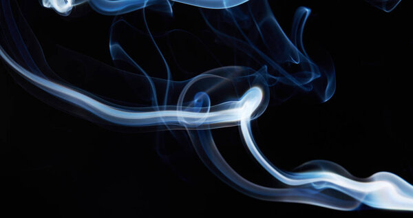 Smoke on black background with abstract blur motion wave swirl . Wisp of Smoke. Cigarette smoke waves and clouds texture