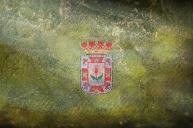 İspanya 'da Granada Espana retro bayrağının grunge desenli üst görüntüsü. İspanyol seyahati ve vatanseverlik kavramı. Bayrak direği yok. Uçak tasarımı, tasarım. Bayrak arkaplanı