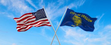 ABD 'nin ve Oregon eyaletinin iki bayrağı güneşli bir günde gökyüzüne karşı bayrak direkleri sallıyor. 3d illüstrasyon