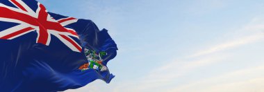 Aziz Helena 'nın resmi bayrağı bulutlu arka planda, günbatımında, panoramik manzaralı. Vatansever ve seyahat kavramı. Geniş afiş afiş için boşluk kopyala. 3d illüstrasyon