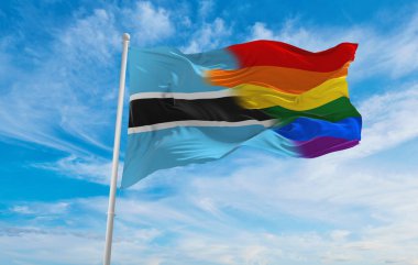 Botsvana bayrağının ulusal lgbt bayrağı bulutlu gökyüzünde rüzgarda dalgalanıyor. Özgürlük ve aşk kavramı. Gurur ayı. Eylemcilik, toplum ve özgürlük kavramı. Uzayı kopyala 3d illüstrasyon