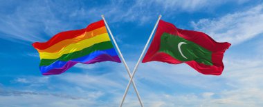 Bulutlu gökyüzünde rüzgarda dalgalanan lgbt ve Maldivler bayrağını aştı. Özgürlük ve aşk kavramı. Gurur ayı. Eylemcilik, toplum ve özgürlük kavramı. Uzayı kopyala 3d illüstrasyon