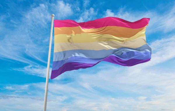 they them lesbian pride flag waving in the wind at cloudy sky. Freedom and love concept. Pride month. activism, community and freedom Concept. Copy space. 3d illustration.
