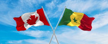 Kanada ve Senegal 'in ulusal bayraklarını aşıp bulutlu gökyüzünde rüzgarda dalgalanan bayrak. İlişkiyi, diyaloğu, iki ülke arasında seyahat etmeyi sembolize ediyor. Uzayı kopyala 3d illüstrasyon