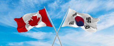 Kanada ve Güney Kore bayrağını aşıp bulutlu gökyüzünde rüzgarda dalgalanan. İlişkiyi, diyaloğu, iki ülke arasında seyahat etmeyi sembolize ediyor. Uzayı kopyala 3d illüstrasyon