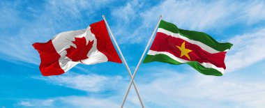 Kanada 'nın ulusal bayraklarını aştı ve bulutlu gökyüzünde rüzgarda dalgalanan Surinam bayrağı. İlişkiyi, diyaloğu, iki ülke arasında seyahat etmeyi sembolize ediyor. Uzayı kopyala 3d illüstrasyon