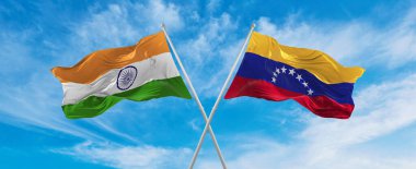 Hindistan ve Venezuela 'nın ulusal bayraklarını aştı bulutlu gökyüzünde rüzgarda dalgalanan bayrak. İlişkiyi, diyaloğu, iki ülke arasında seyahat etmeyi sembolize ediyor. Uzayı kopyala 3d illüstrasyon