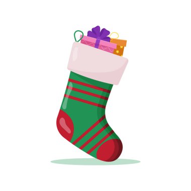 İçinde hediyeler olan Noel çorabı. Kış aksesuarları