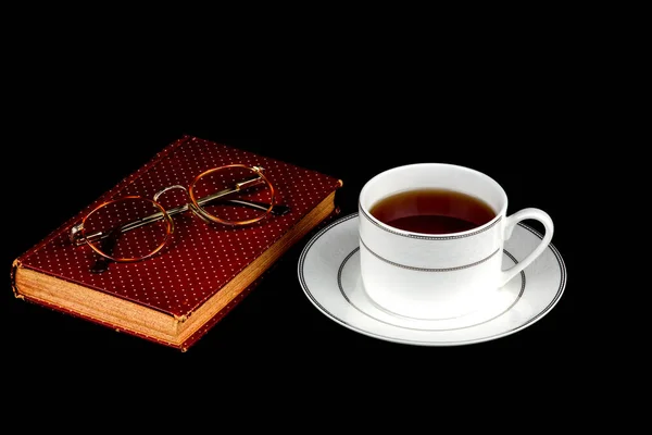 Cup Tea Spectacles Old Book Black Background — Stock Photo, Image