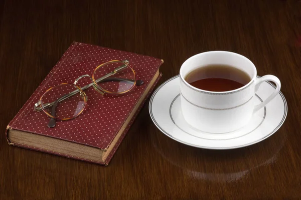 Cup Tea Old Book Spectacles Old Polished Wooden Surface — Stock Photo, Image