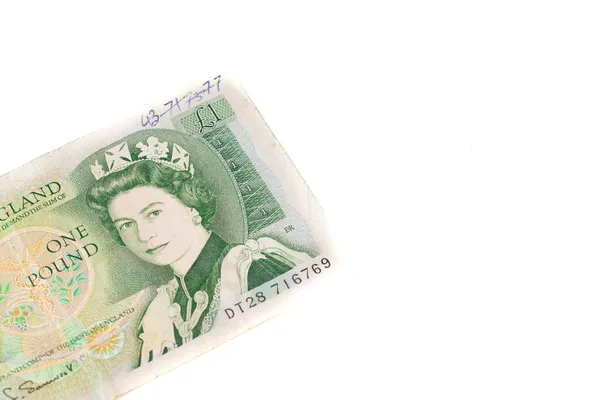 Den Helder, i Paesi Bassi. Ottobre 2021. Una banconota da una sterlina con la regina Elisabetta su sfondo bianco. — Foto Stock