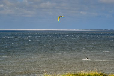 Den Helder, the Netherlands. November 2021. A kitesurfer off the coast near Den Helder, Nederland. 