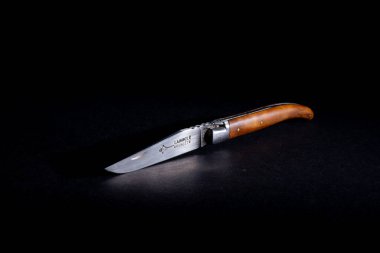 Amsterdam, netherlands. june 2022. Close up of a Laguiole folding knife on a black background. High quality photo. Close up. Selective focus. clipart