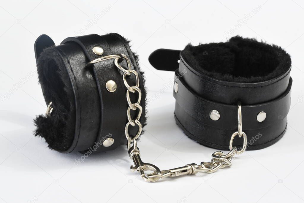 Den Helder, Netherlands. June 2022. A pair of handcuffs on a white background. High quality photo