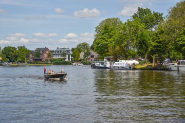 Amsterdam, Netherlands. August 2022. The mansions along the river Amstel near Amsterdam. High quality photo