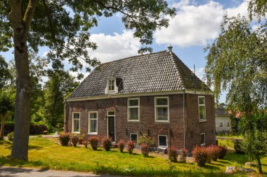 Amsterdam, Netherlands. August 2022. The mansions along the river Amstel near Amsterdam. High quality photo