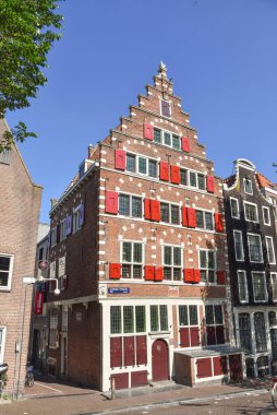 Amsterdam, Netherlands. August 2022. A historic canal house on the Oudezijds Voorburgwal in Amsterdam. High quality photo