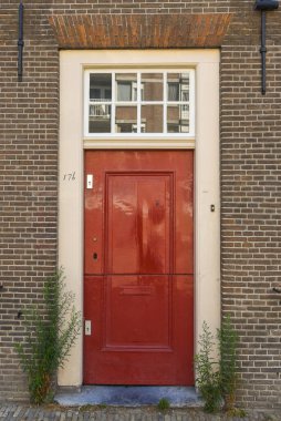 Amsterdam, Netherlands. August 2022. The authentic front door of a canal house inAmsterdam. High quality photo