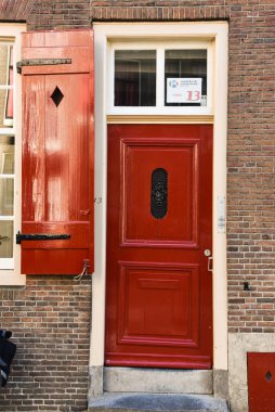 Amsterdam, Netherlands. August 2022. The authentic front door of a canal house inAmsterdam. High quality photo