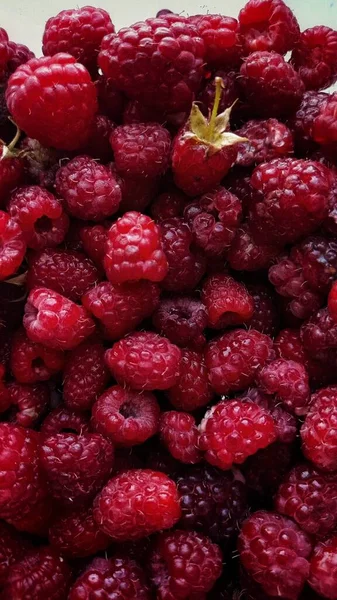 raspberry on a white plate close up. fresh berries.