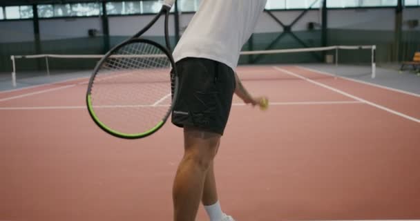 Single training of playing tennis, throwing tennis ball with a racket over net — Stock Video