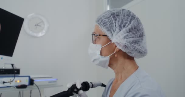 An ENT examines the patients sinuses using a medical mini camera — Stock Video