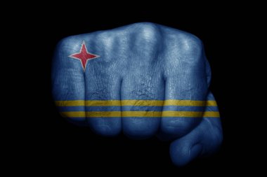 Siyah arka planda güçlü bir yumruğa boyanmış Aruba bayrağı