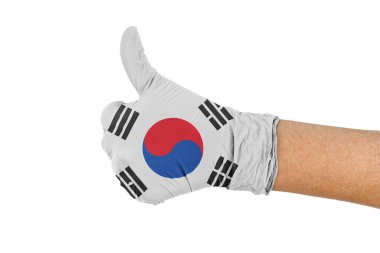 Sağlık eldiveninde Güney Kore bayrağı baş parmak işareti gösteriyor.