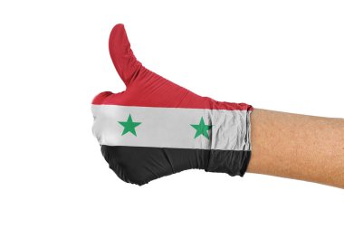 Sağlık eldiveninde Suriye bayrağı baş parmak işareti