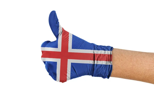 医用手套上挂着冰岛国旗 上面有大拇指的标志 — 图库照片