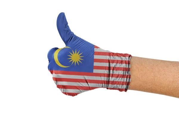 의학용 장갑을 엄지손가락 말레이시아 국기를 게양하는 — 스톡 사진