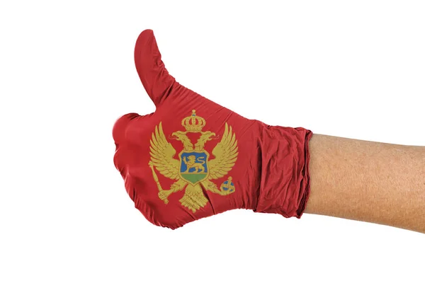 Montenegro Flagge Auf Einem Medizinischen Handschuh Zeigt Daumen Nach Oben — Stockfoto