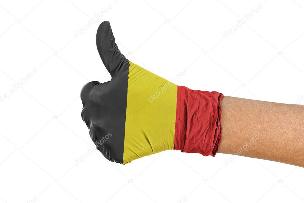 Belgium flag on a hand glove showing thumbs up sign