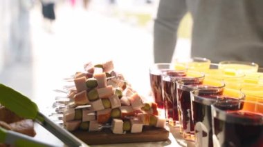 Catering service on banquet table with canape snacks and drinks in restaurant or hotel. Decorated food set on birthday, wedding celebration or business conference event venue.