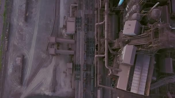 Aerial of industrial city with air atmosphere and river water pollution from metallurgical plant and blast furnaces near sea. Dirty smoke, smog from pipes of steel factory. Ecological issues concept. — Wideo stockowe