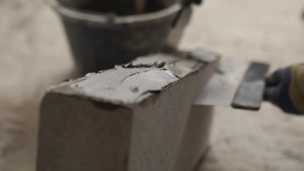 Bricklayer Applies Adhesive Glue Autoclaved Aerated Concrete Blocks Notched Trowel — Stock Video