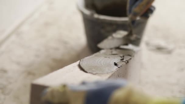 Bricklayer Applies Adhesive Glue Autoclaved Aerated Concrete Blocks Trowel Spatula — Stock Video