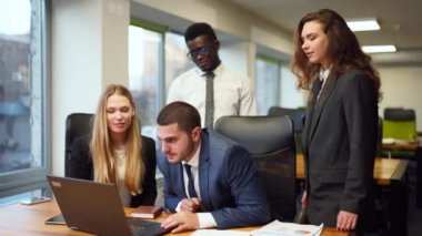 Diverse office corporate workers celebrate successful contract agreement. Excited business team gives high five about tender, auction win. Multiethnic brokers rejoice about stock market deal victory.