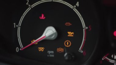 Many car dashboard lights with warning lamps, failure and error indicators light up on car ignition and start illuminated. Engine failure warning in vehicle.
