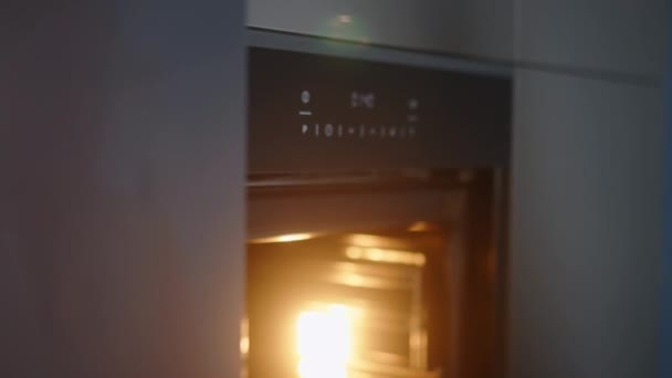 Caucasian Woman Opens Door Heated Oven Puts Pot Baking Turns — Stok video