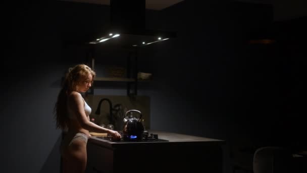 Young Woman Kitchen Puts Kettle Stove Girl Turns Gas Just — Vídeo de Stock