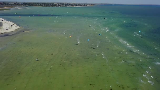 Aerial Many Kiteboarders Colorful Kites Flying Blue Sea Lagoon Ride — Stockvideo