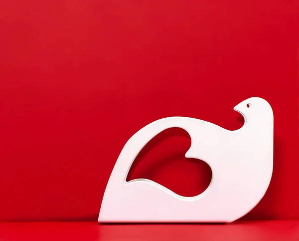 Graceful Heart Shape Dove Figurine Red Paper Background Close Copy — Stock Photo, Image