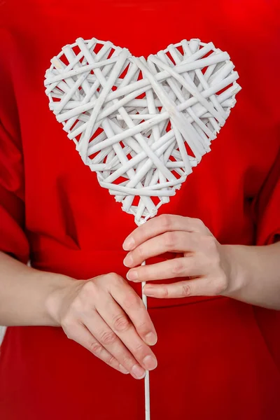 Woman Red Dress Holds White Wicker Heart Her Hands Vertically — Stock Photo, Image