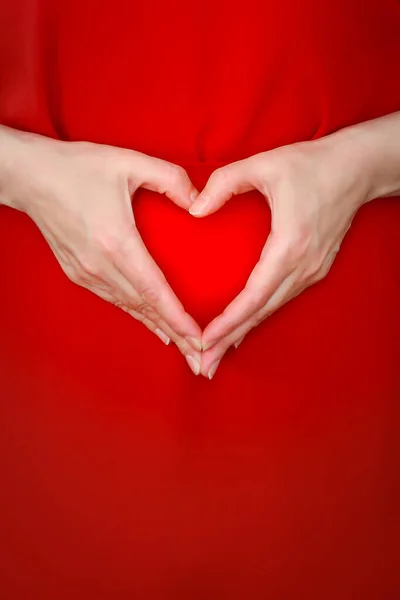 Woman Red Dress Depicts Her Hands Symbolic Figure Heart Level — Stock Photo, Image