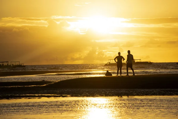 a man and a woman in the beach